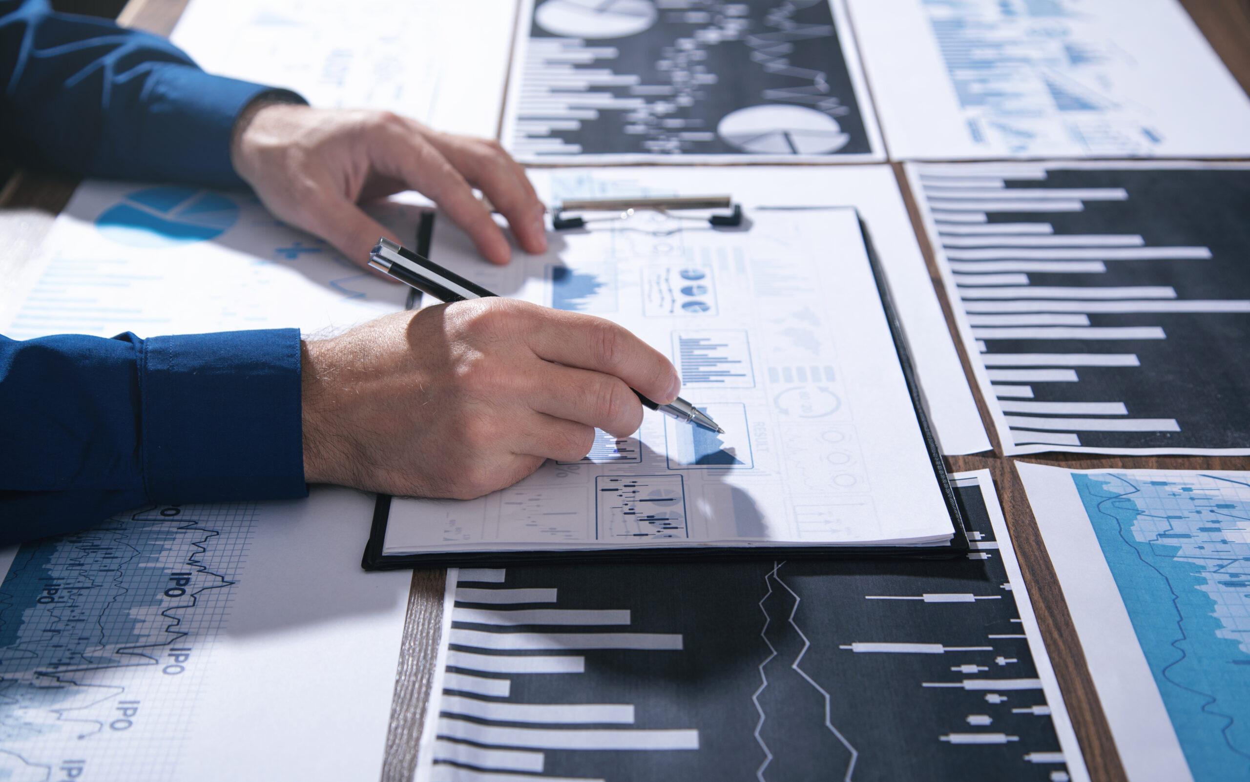 Businessman working in financial graphs